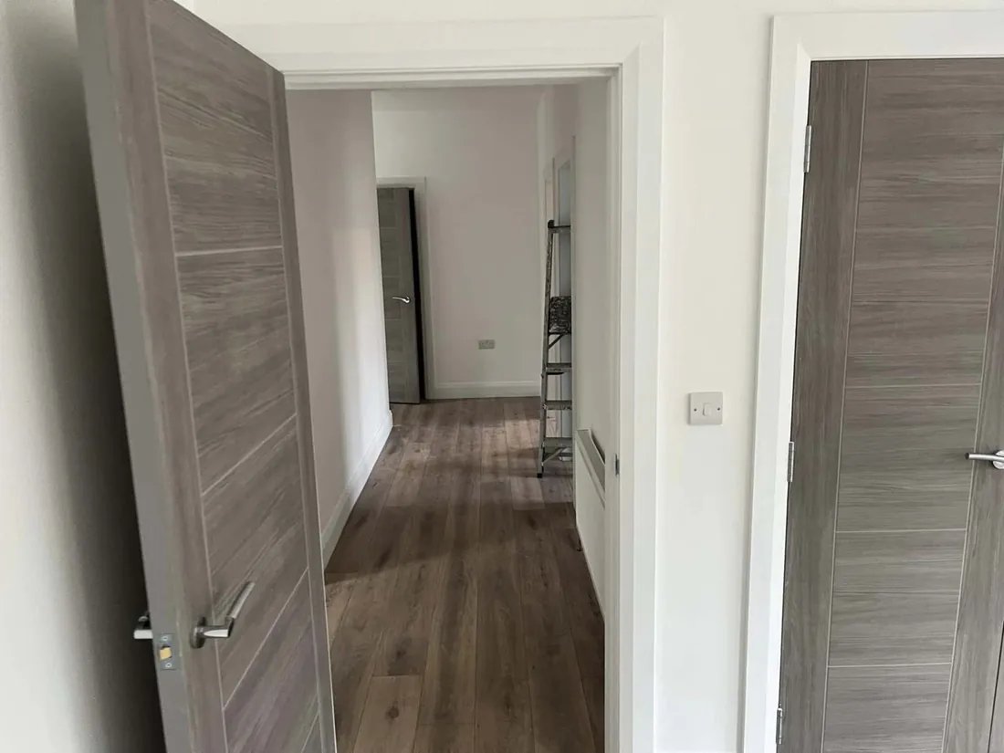 Interior doors and frames fitted in a new hallway