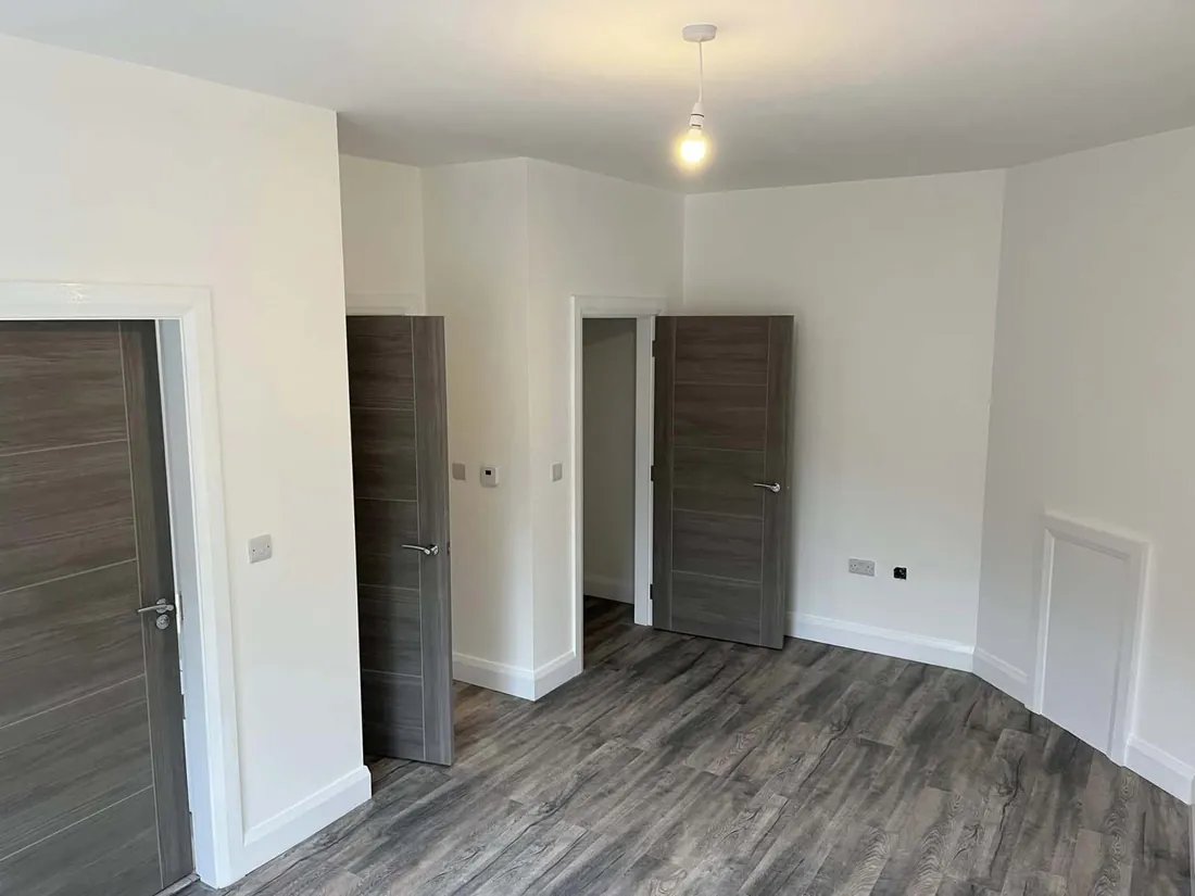 Finished hallway with doors, architraves and skirting