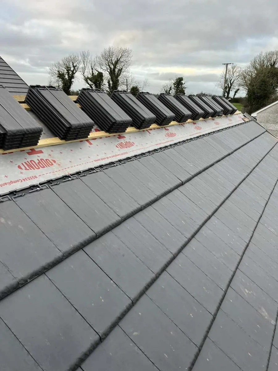 Close-up of natural slate roofing in progress