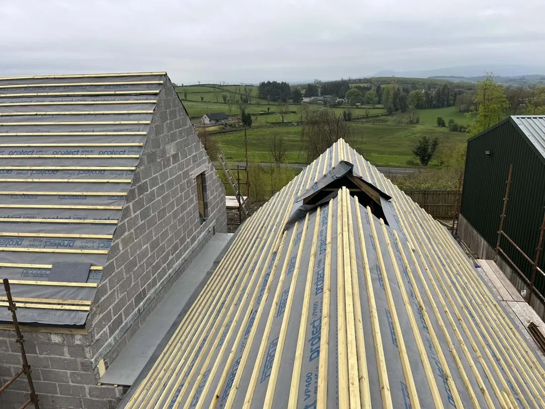 Natural slate roof with new timber battens and lead valley