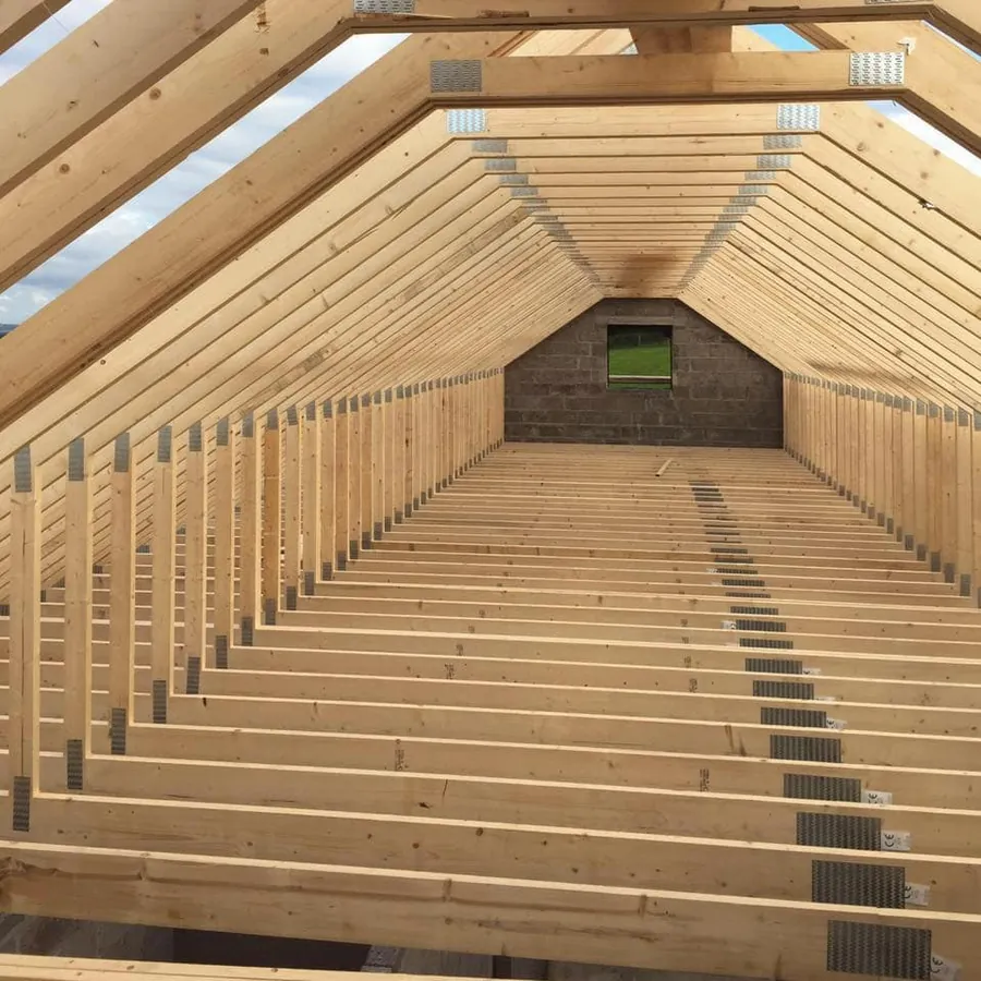 New timber roof structure and rafters during a build