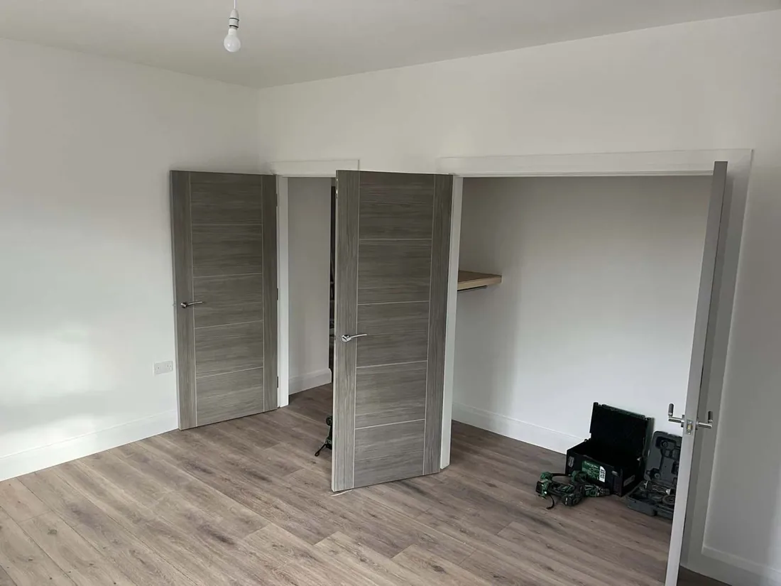 Interior hallway with finished doors, frames and flooring